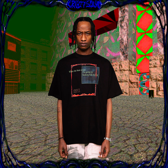 Model wearing black oversize t-shirt with When the Beat Drops -print in chest