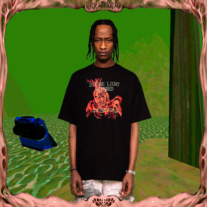 Model wearing black oversize t-shirt with Divine Light Severed -print from Cruelty Squad
