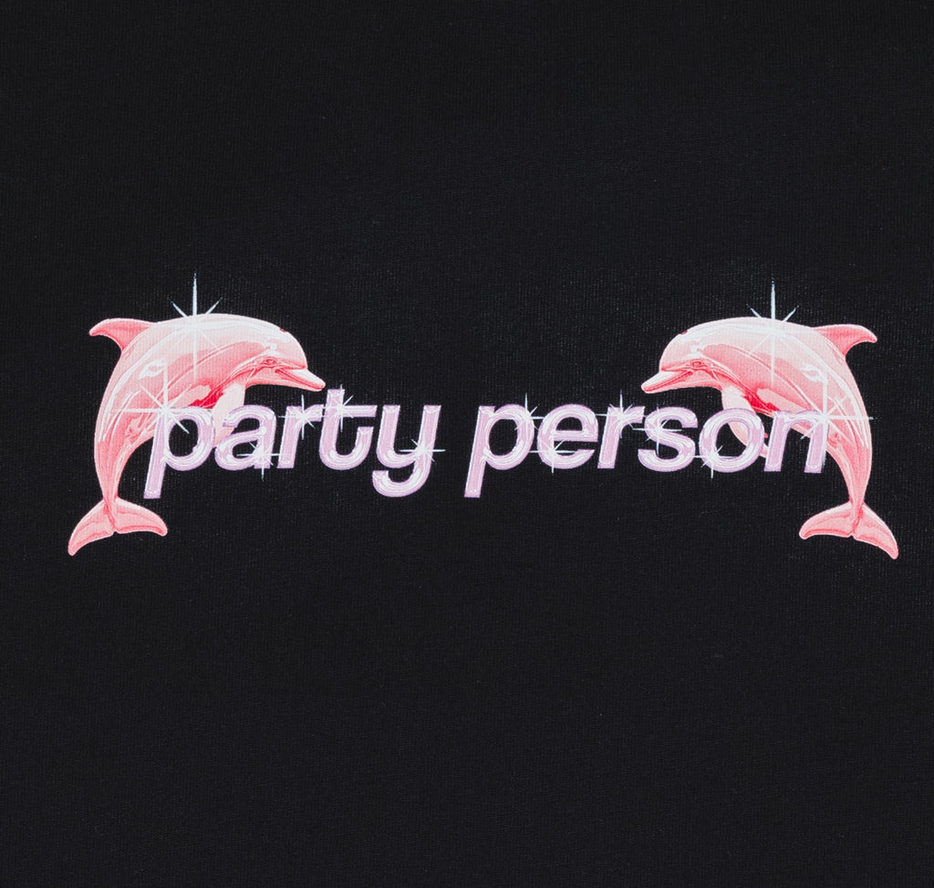 Closeup of party person print with two plastic dolphins