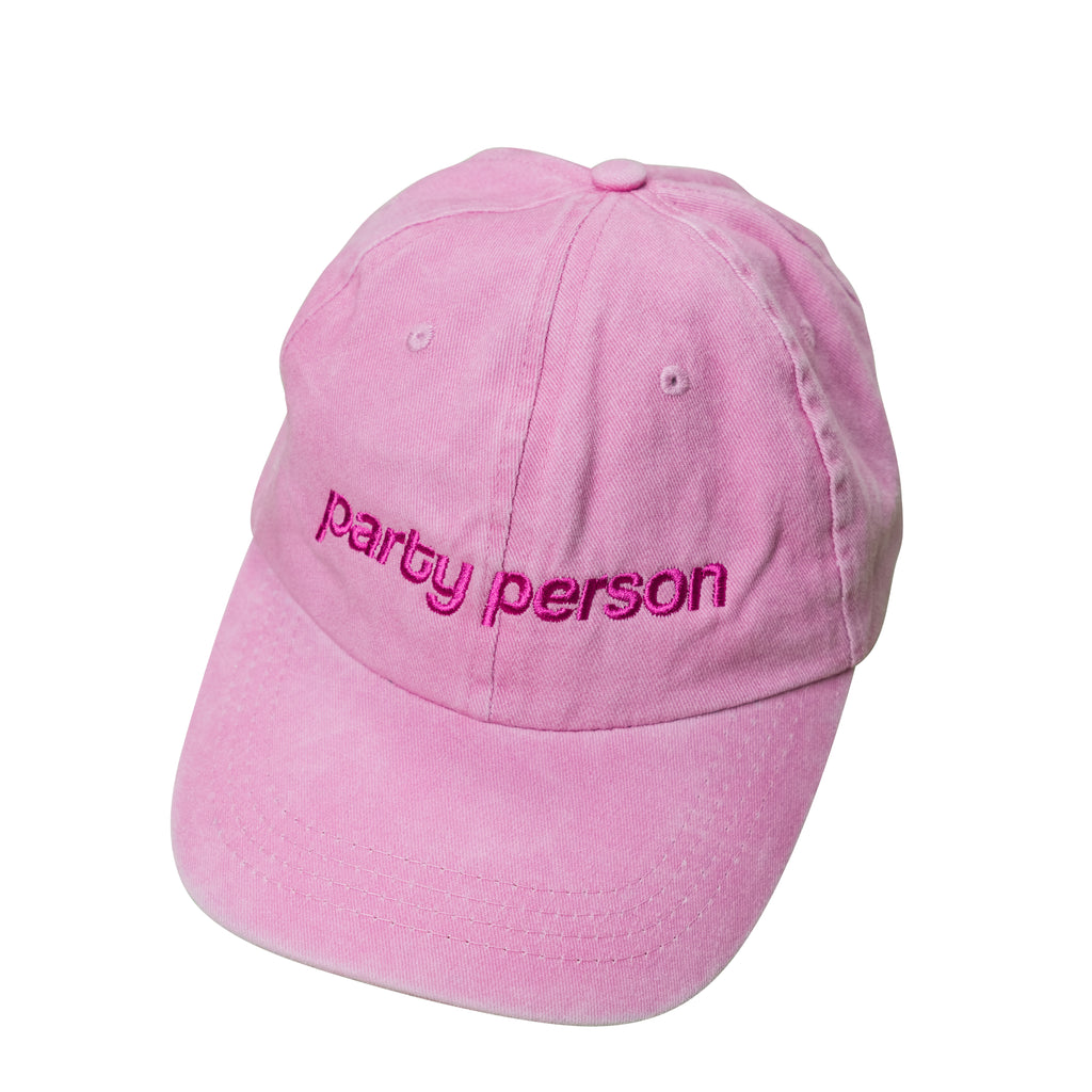 6 panels pink washed dad cap. with party person embroidery. Low profile, curved peak.